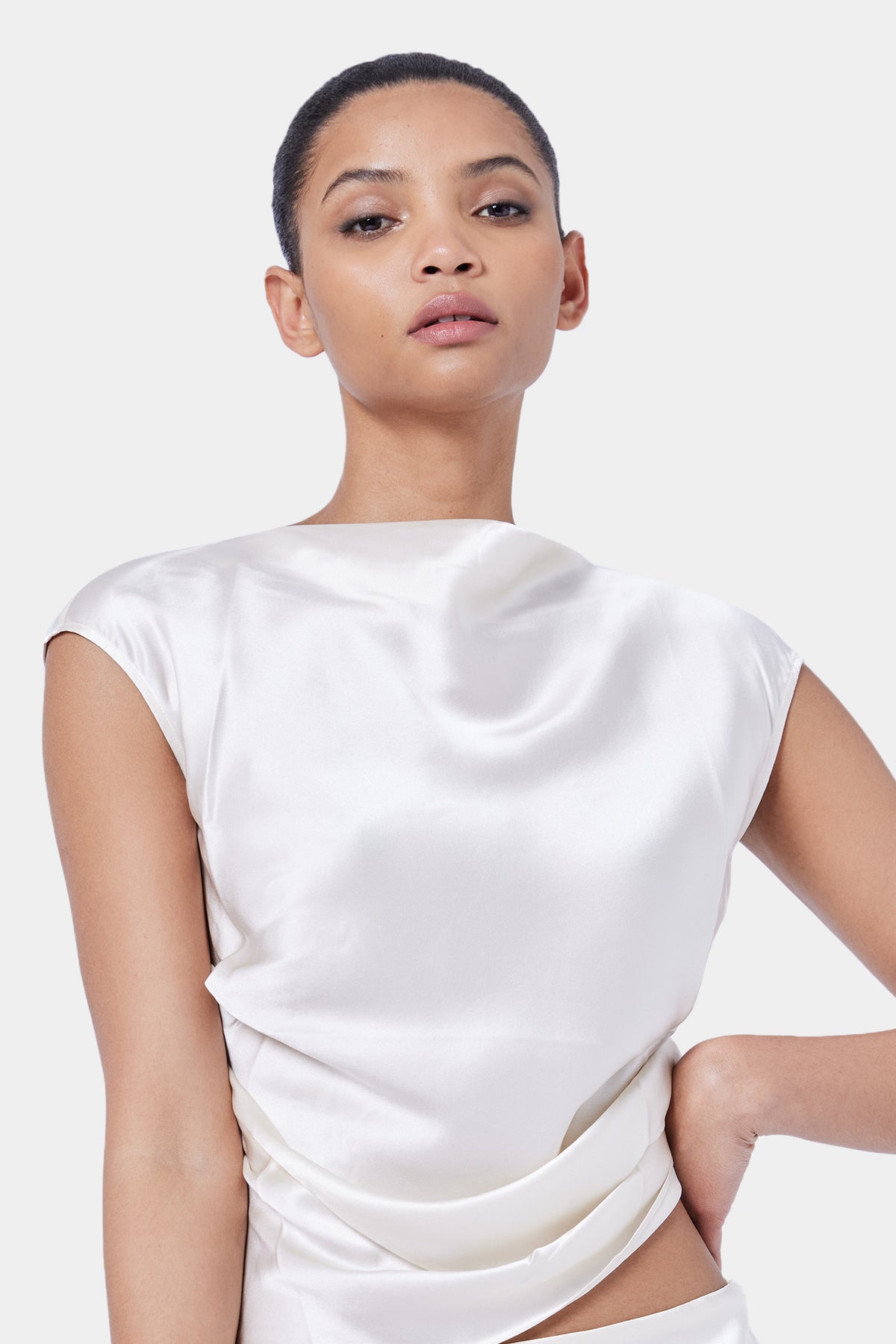 The Sleeveless Tucked Top By GINIA In Cream