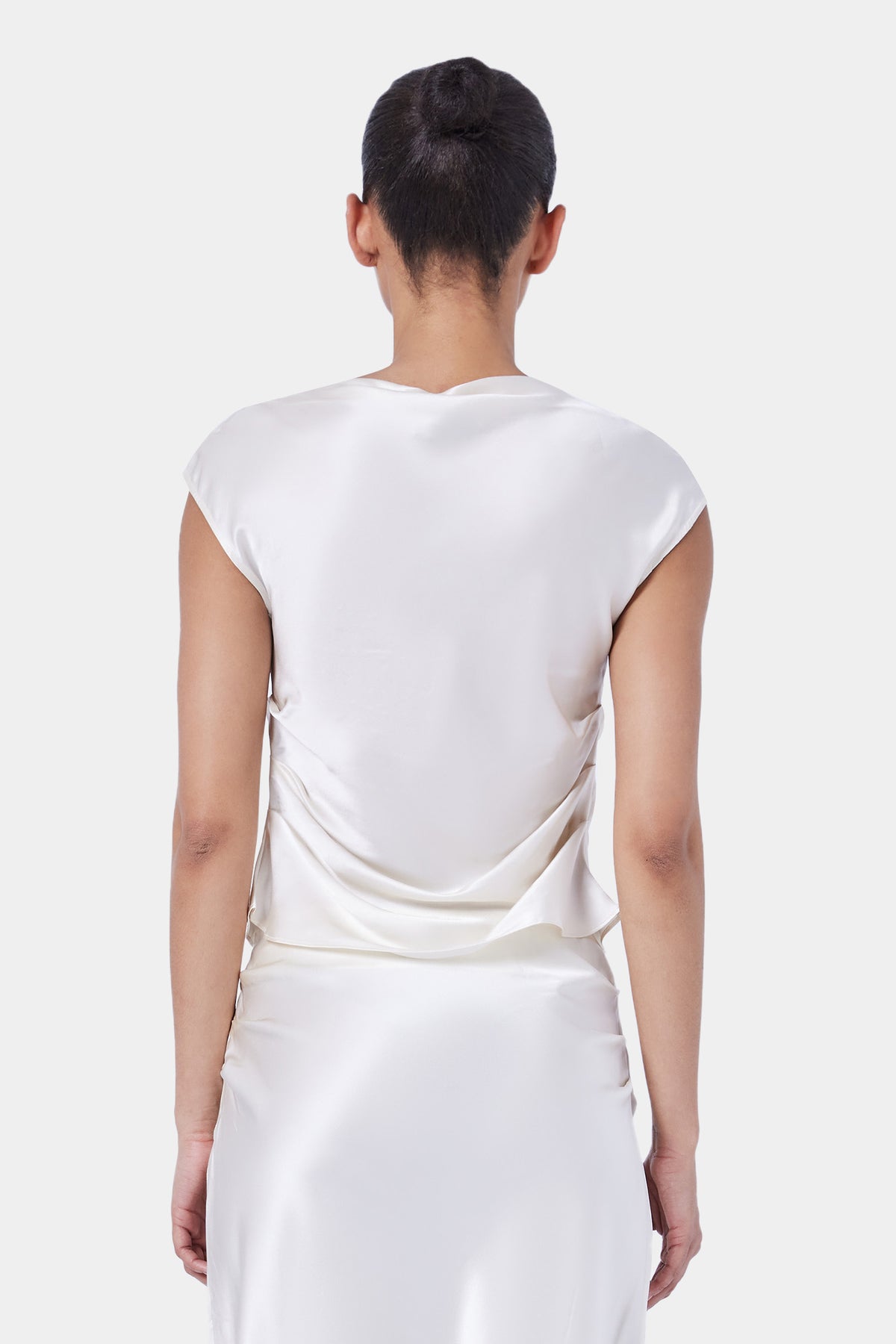 The Sleeveless Tucked Top By GINIA In Cream